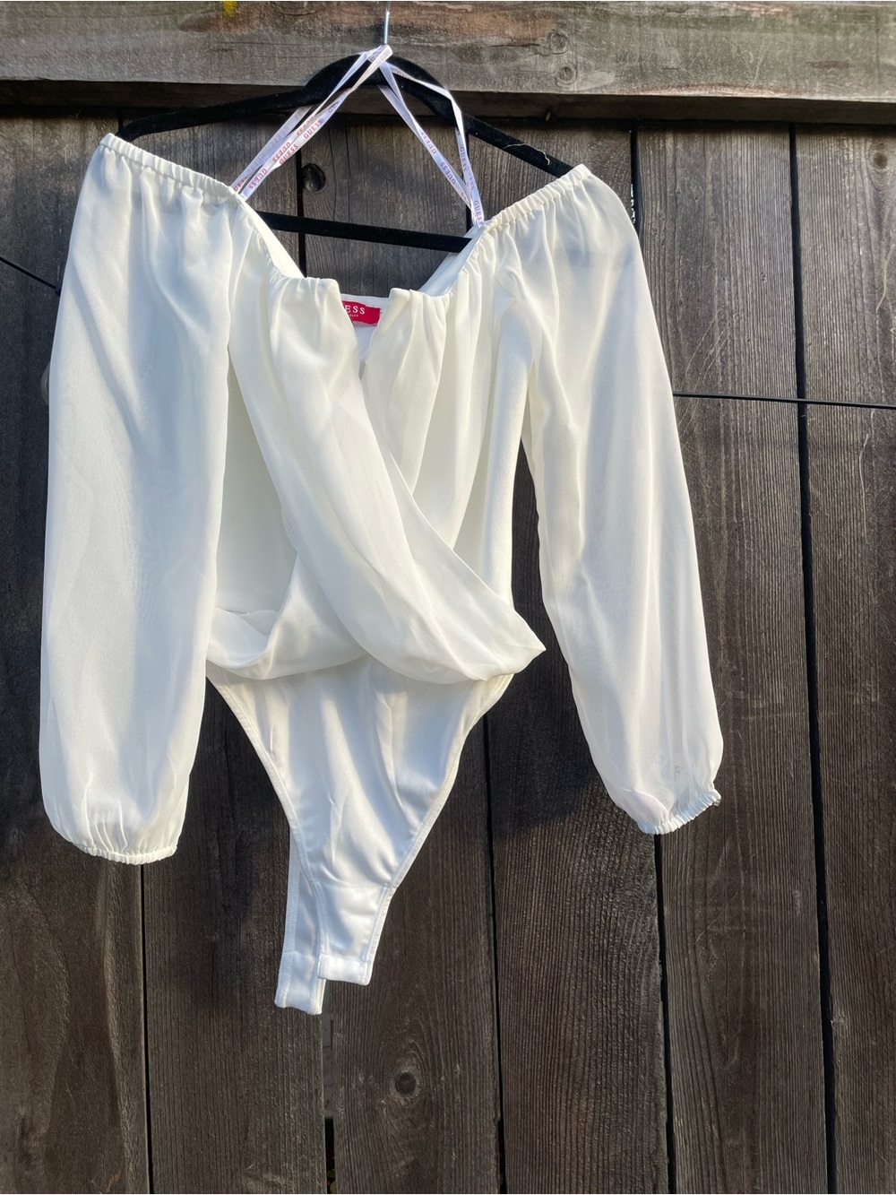 Guess Off-Shoulder Long Sleeve Bodysuit in Cream White